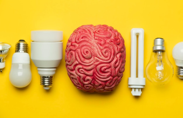 Bright idea brain with lightbulb inspiration innovation\
solution concept