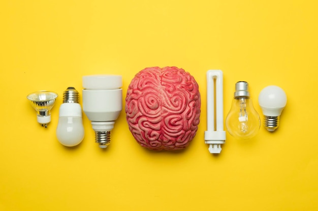 Bright idea brain with lightbulb inspiration innovation\
solution concept