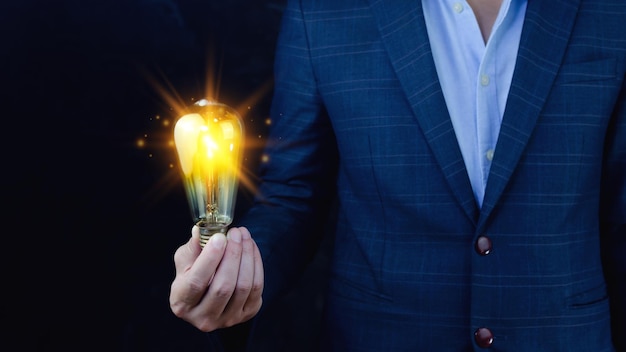 Bright idea in hand Business manHands holding light bulb for concept new idea concept with innovation and inspirationtechnology in science and communication concept