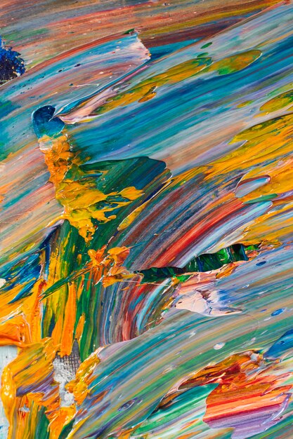 Bright, juicy, multi-colored abstraction of their mixing of oil paints on a palette close-up.