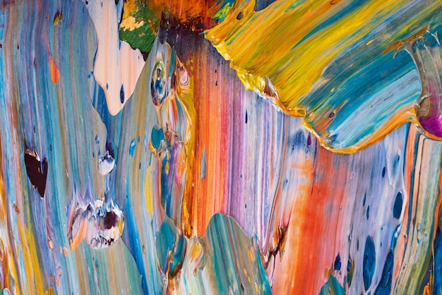 Bright, juicy, multi-colored abstraction of their mixing of oil paints on a palette close-up.