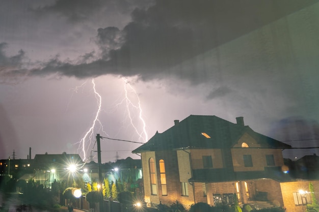 Bright lightnings over the city at the night