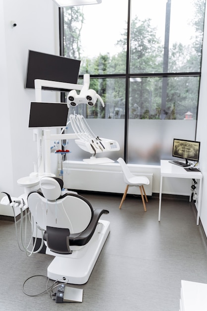 Bright, modern office with working dental equipment. Dental chair and work tools