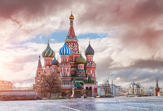 A bright morning near St. Basil's Cathedral on Red Square in Moscow and lilac clouds in the sky