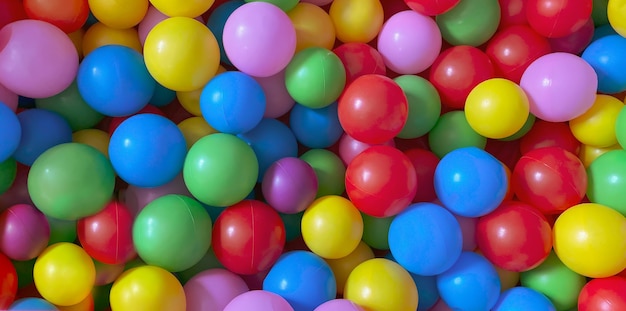 Bright multi-colored balls for the dry pool for childrens games.Toys, development for kids.Bright multi-color background.