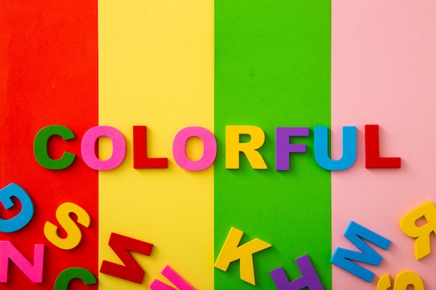 Photo bright multicolored alphabet with colorful wording background