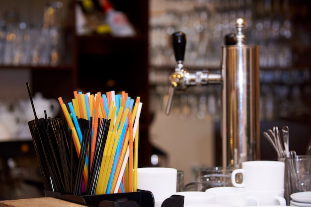 Bright multicolored straws on the bar.