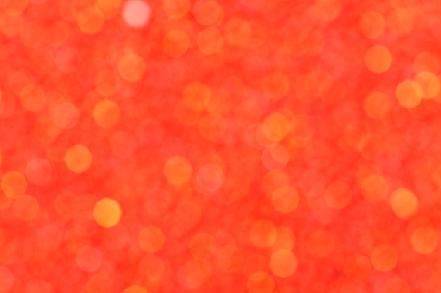 Bright orange abstract bokeh light shines background