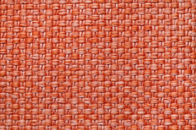 Bright orange textile background with checkered ,  Structure of the fabric macro,