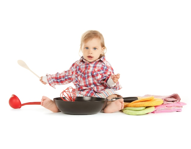 bright picture of adorable baby cook with pan.