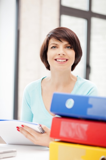 bright picture of beautiful woman with folders