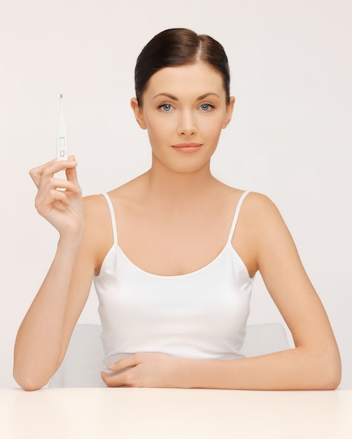 bright picture of beautiful woman with thermometer