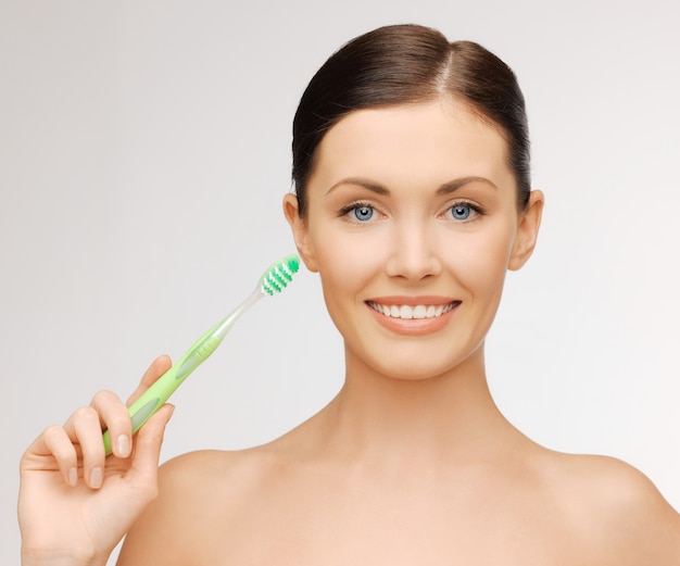 bright picture of beautiful woman with toothbrush