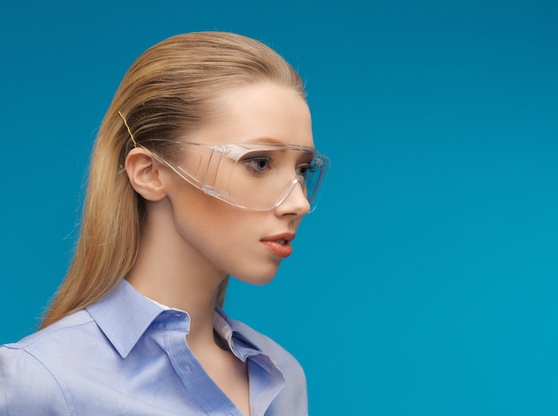 bright picture of businesswoman in protective glasses