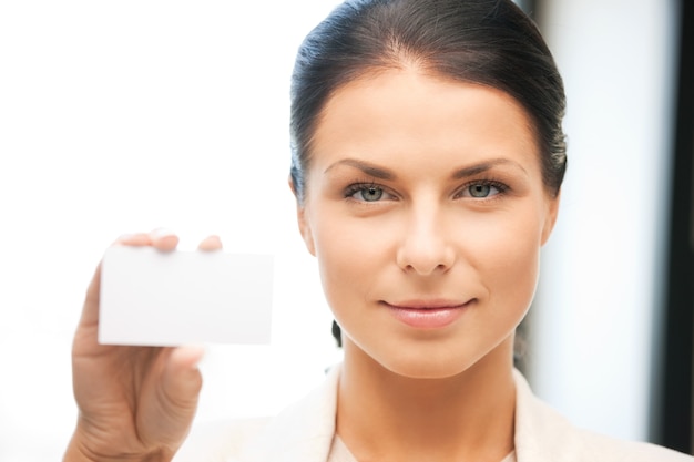 bright picture of confident woman with business card