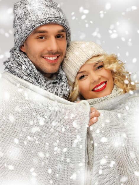 bright picture of family couple under warm blanket