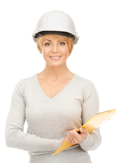 bright picture of female contractor in helmet over white