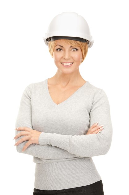 bright picture of female contractor in helmet over white