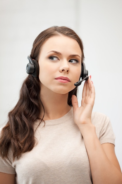 bright picture of friendly female helpline operator