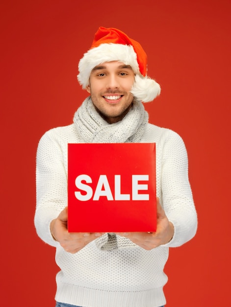 bright picture of handsome man in christmas hat.