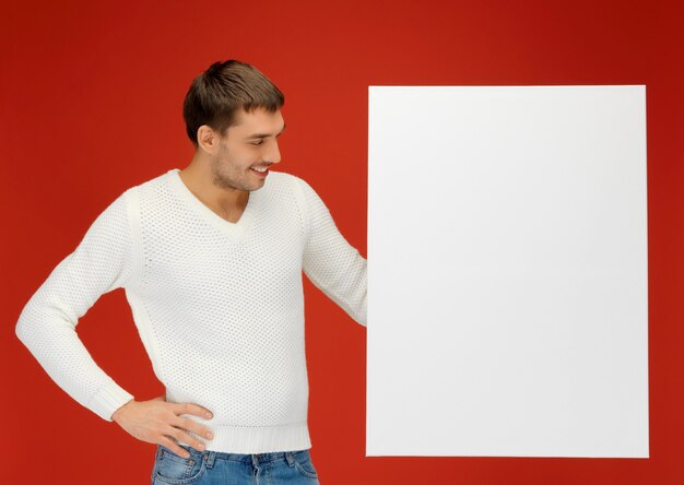 bright picture of handsome man with big blank board.