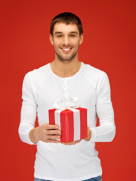 bright picture of handsome man with a gift .