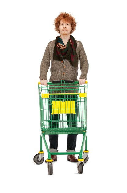 Photo bright picture of handsome man with shopping cart