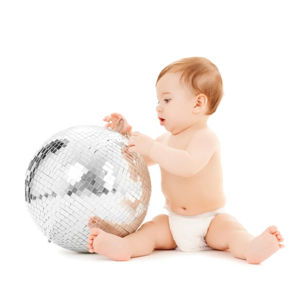 bright picture of happy child playing with disco ball