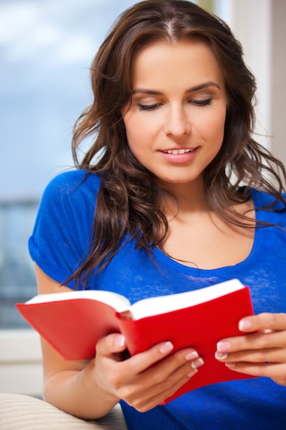 bright picture of happy and smiling woman with book..