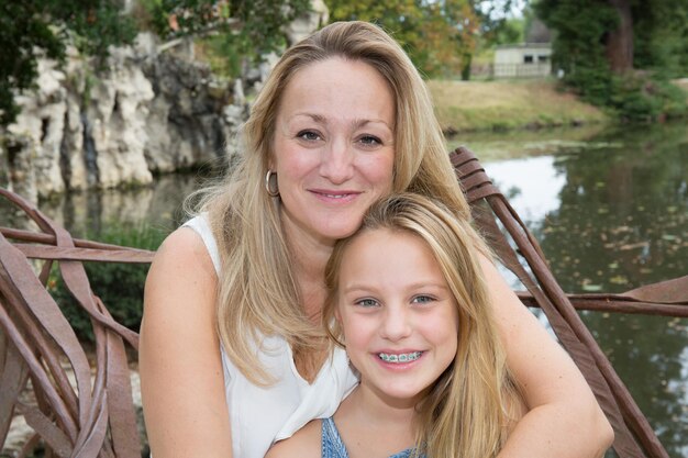 Bright picture of hugging mother and daughter