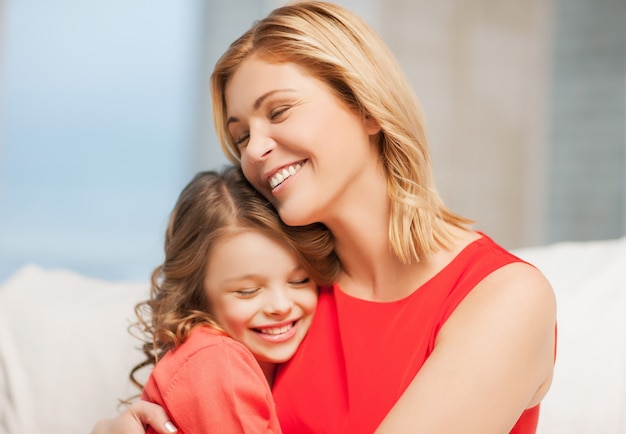 bright picture of hugging mother and daughter