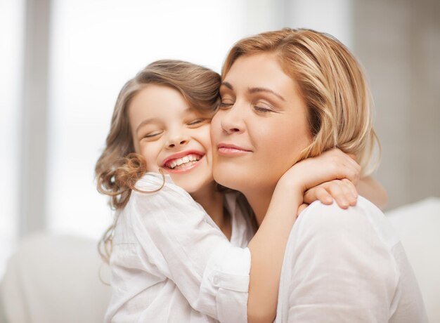 bright picture of hugging mother and daughter