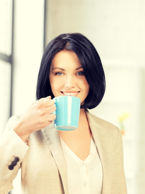 bright picture of lovely businesswoman with mug