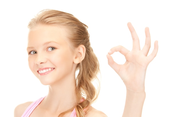 bright picture of lovely girl showing ok sign