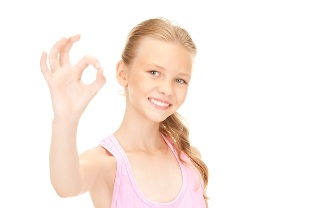 bright picture of lovely girl showing ok sign