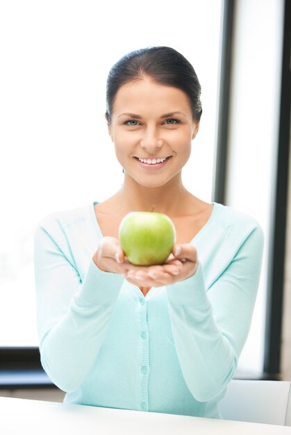 bright picture of lovely housewife with green apple