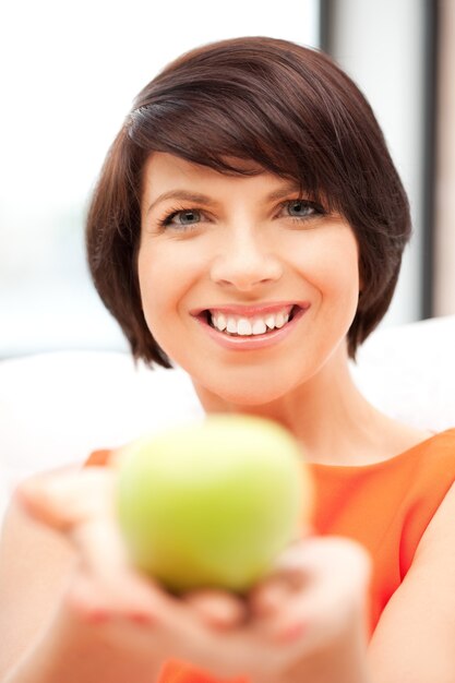 bright picture of lovely housewife with green apple