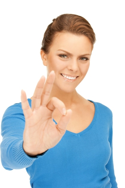 bright picture of lovely teenage girl showing ok sign