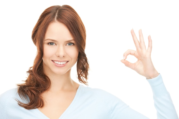 bright picture of lovely teenage girl showing ok sign