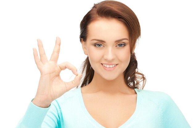 bright picture of lovely teenage girl showing ok sign