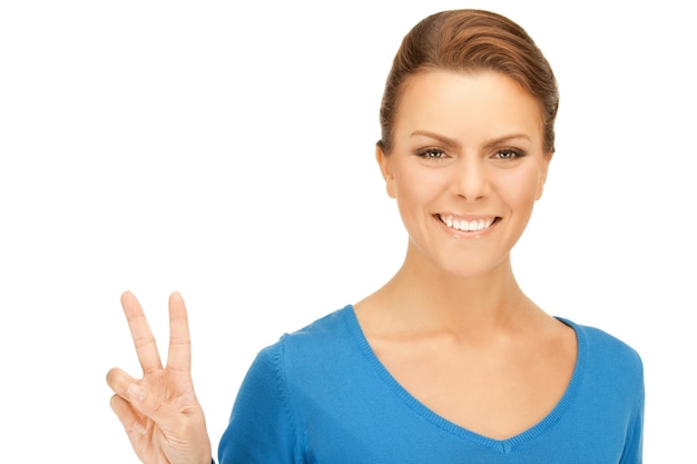 bright picture of lovely teenage girl showing victory sign