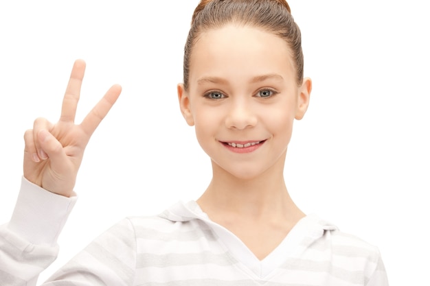 bright picture of lovely teenage girl showing victory sign