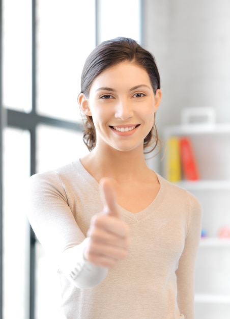 bright picture of lovely teenage girl with thumbs up