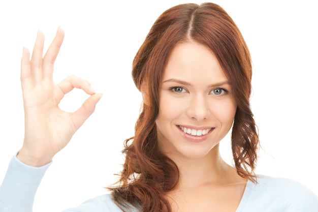 bright picture of lovely woman showing ok sign