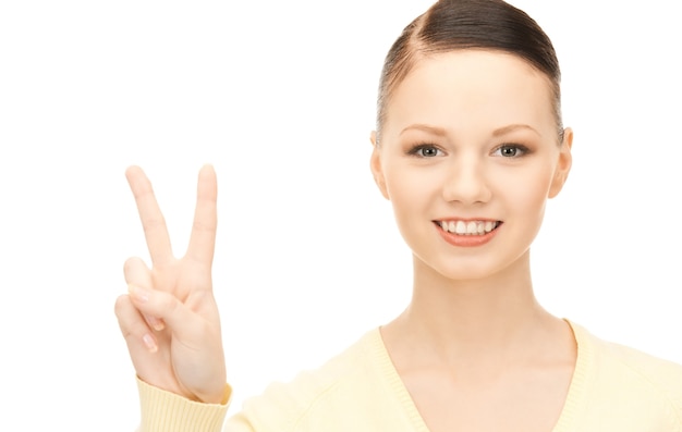 bright picture of lovely woman showing victory sign