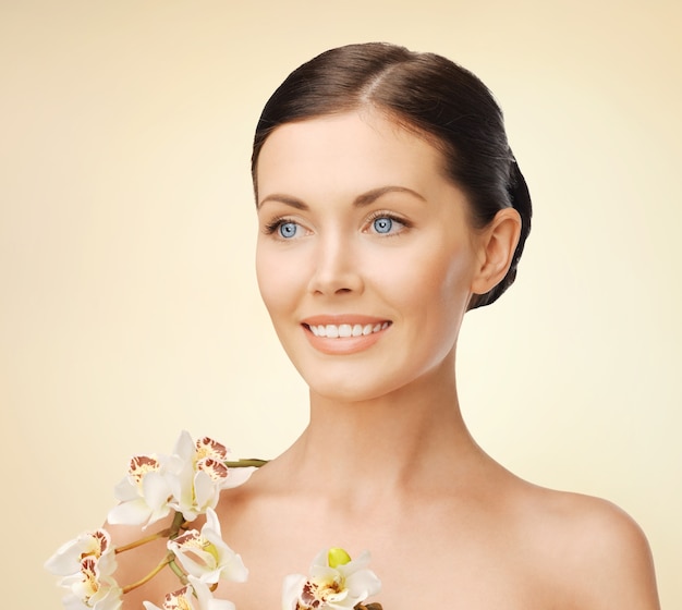 bright picture of lovely woman with orchid flower