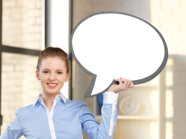 Bright picture of smiling businesswoman with blank text bubble