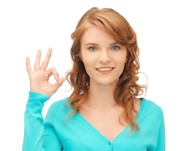 bright picture of teenage girl showing ok sign