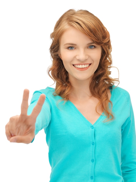 bright picture of teenage girl showing victory sign