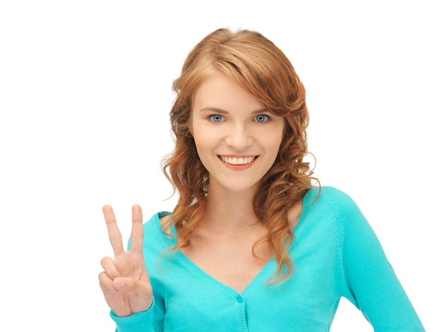 bright picture of teenage girl showing victory sign